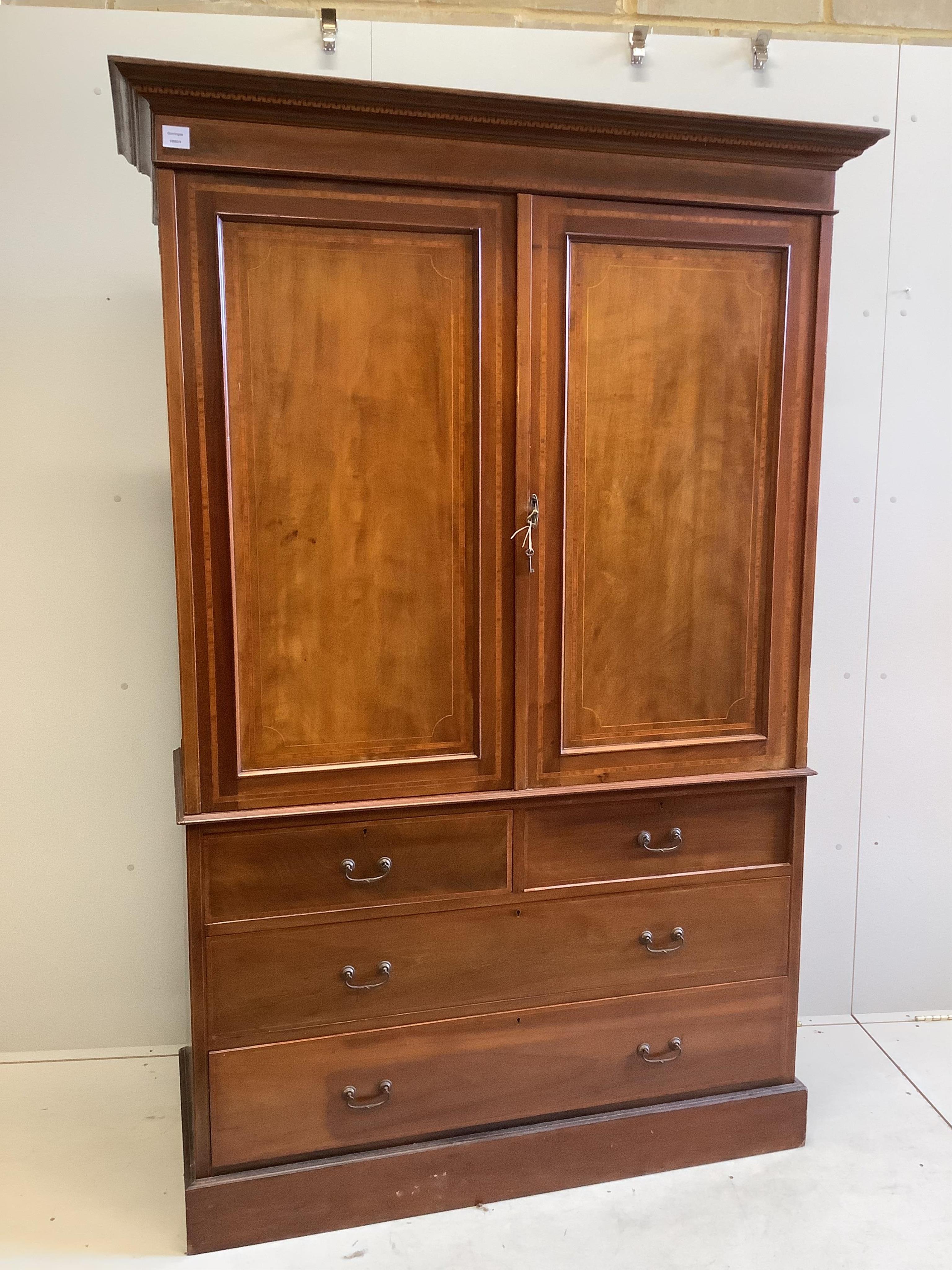 An Edwardian satinwood banded mahogany linen press, width 134cm, depth 56cm, height 200cm. Condition - fair